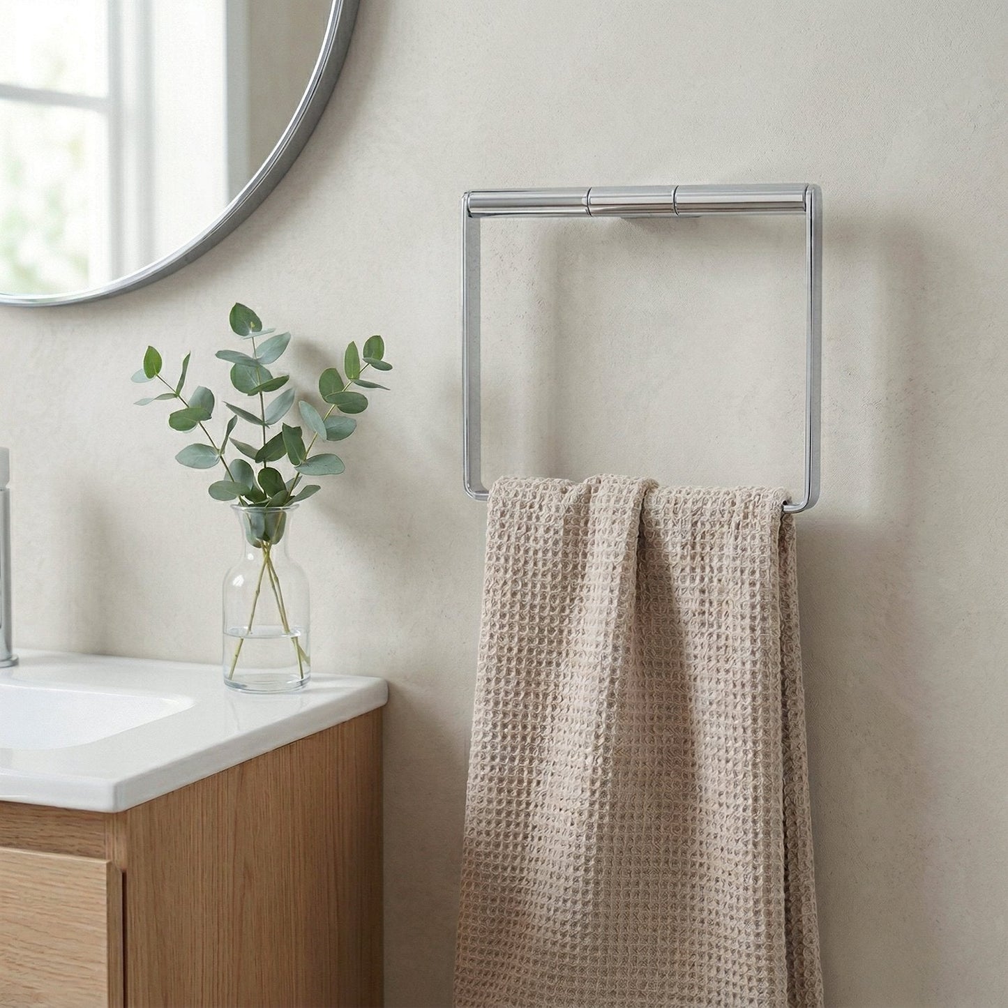 Wall-mounted towel rind AK344 in bathroom setting with towel