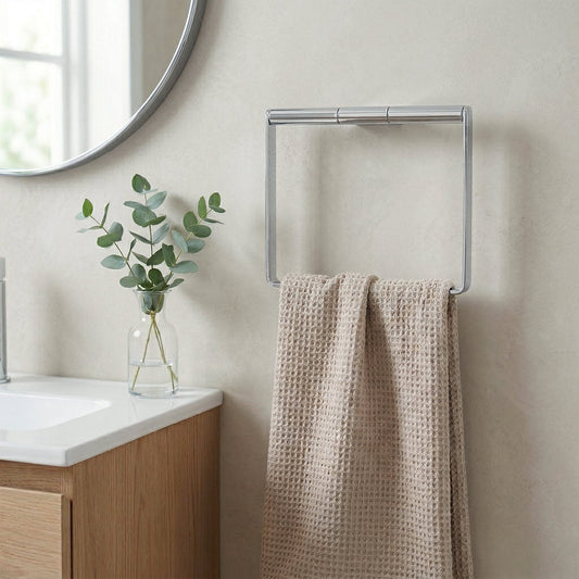 Wall-mounted towel rind AK344 in bathroom setting with towel
