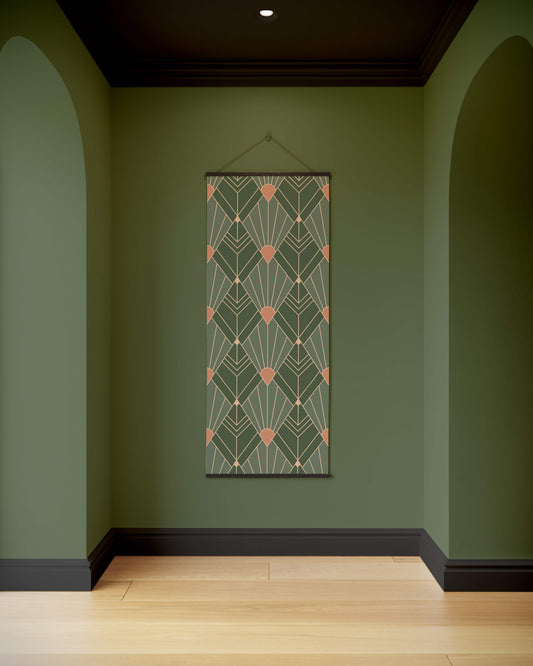 Decorative wall hanging with geometric pattern on a green wall