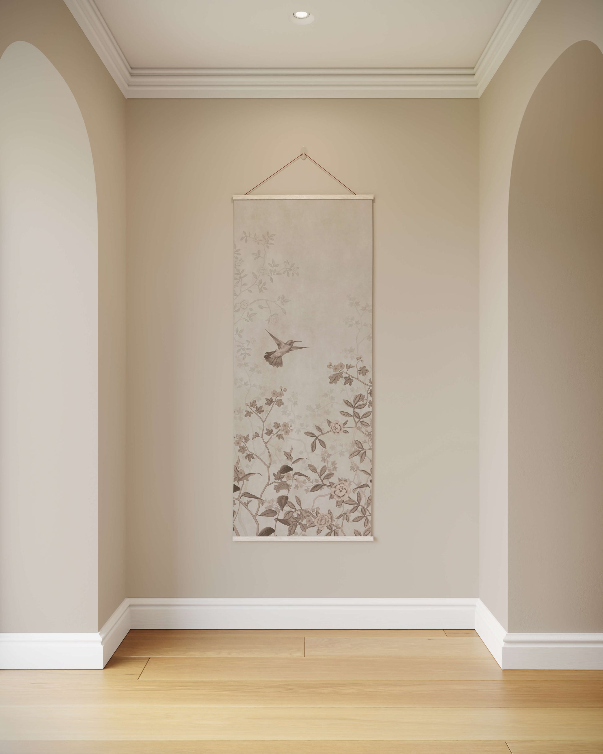 Floral scroll wall art hanging on a beige wall with wooden flooring.