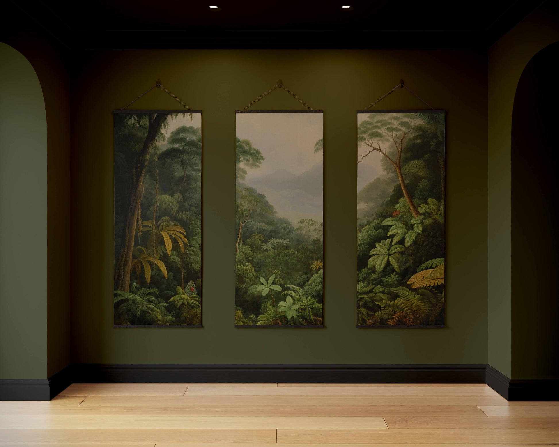 Three framed artworks depicting a forest scene on a dark wall.