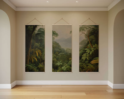 Three hanging wall art pieces depicting forest scenes on a beige wall.