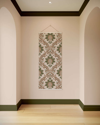 Decorative wall hanging with floral pattern on a plain wall.