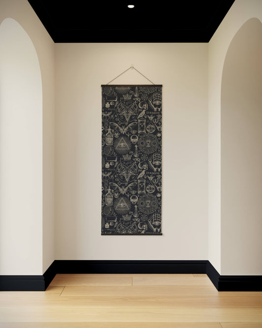 Decorative wall hanging with geometric patterns on a plain wall.