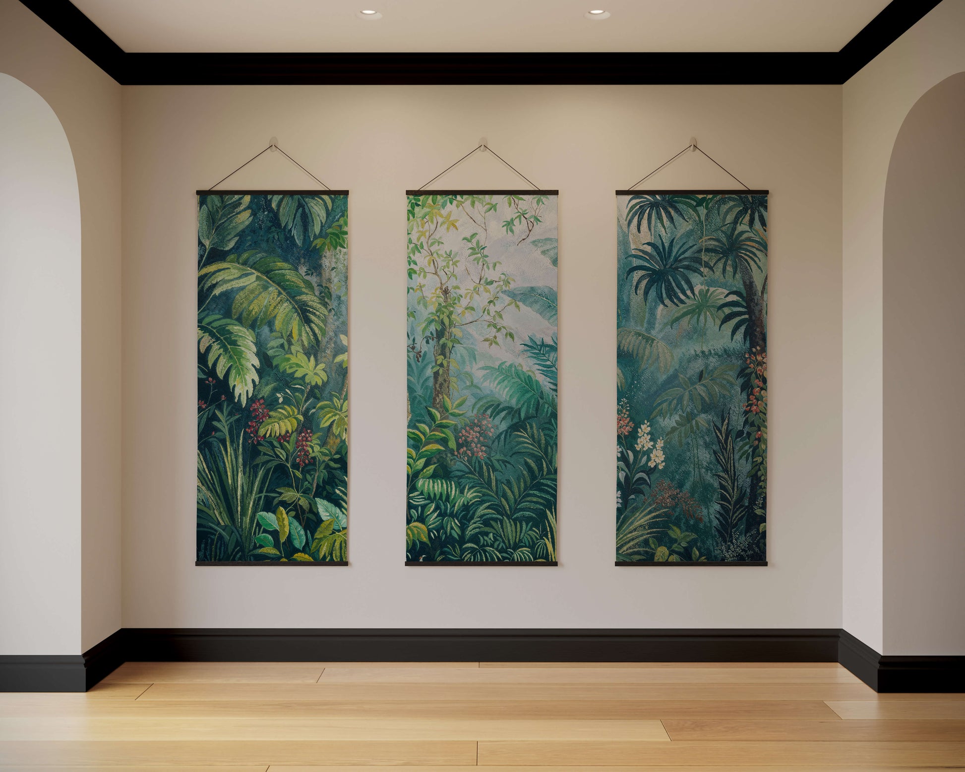 Three vertical tropical forest artworks hanging on a wall.