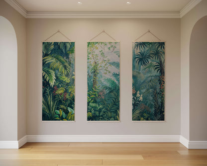 Three vertical tropical forest artworks hanging on a wall.