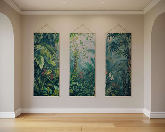 Three vertical tropical forest artworks hanging on a wall.