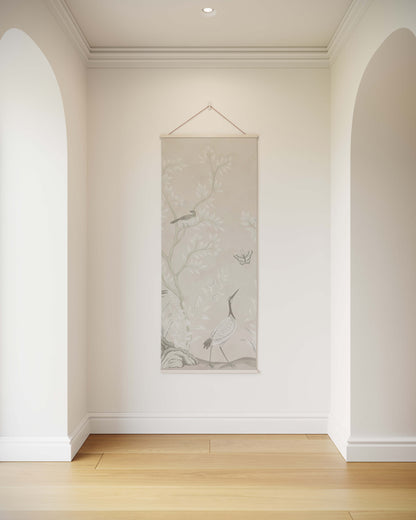 Decorative wall hanging in a room with white walls and wooden flooring