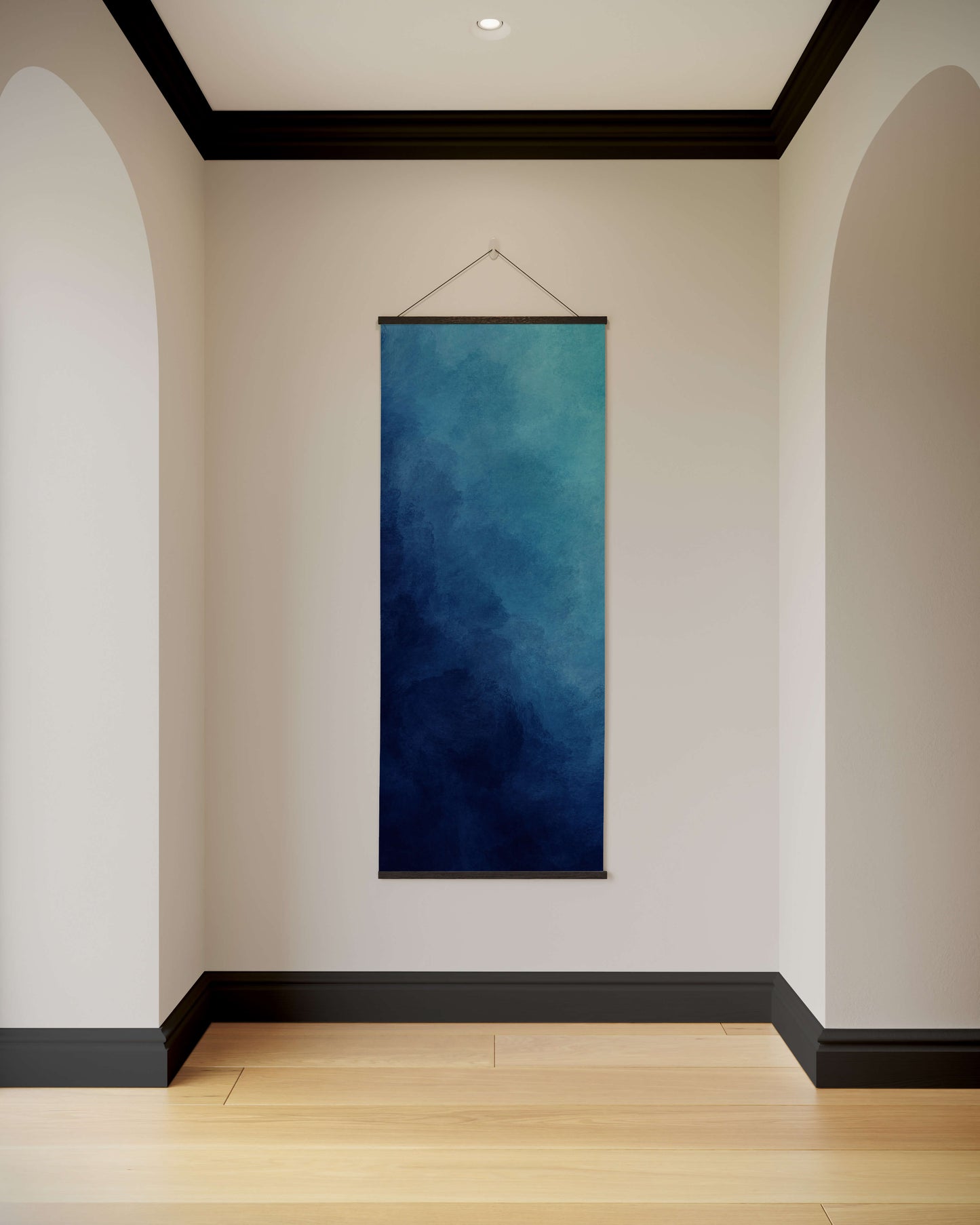 Blue abstract painting hanging on a white wall with arches and a wooden floor.