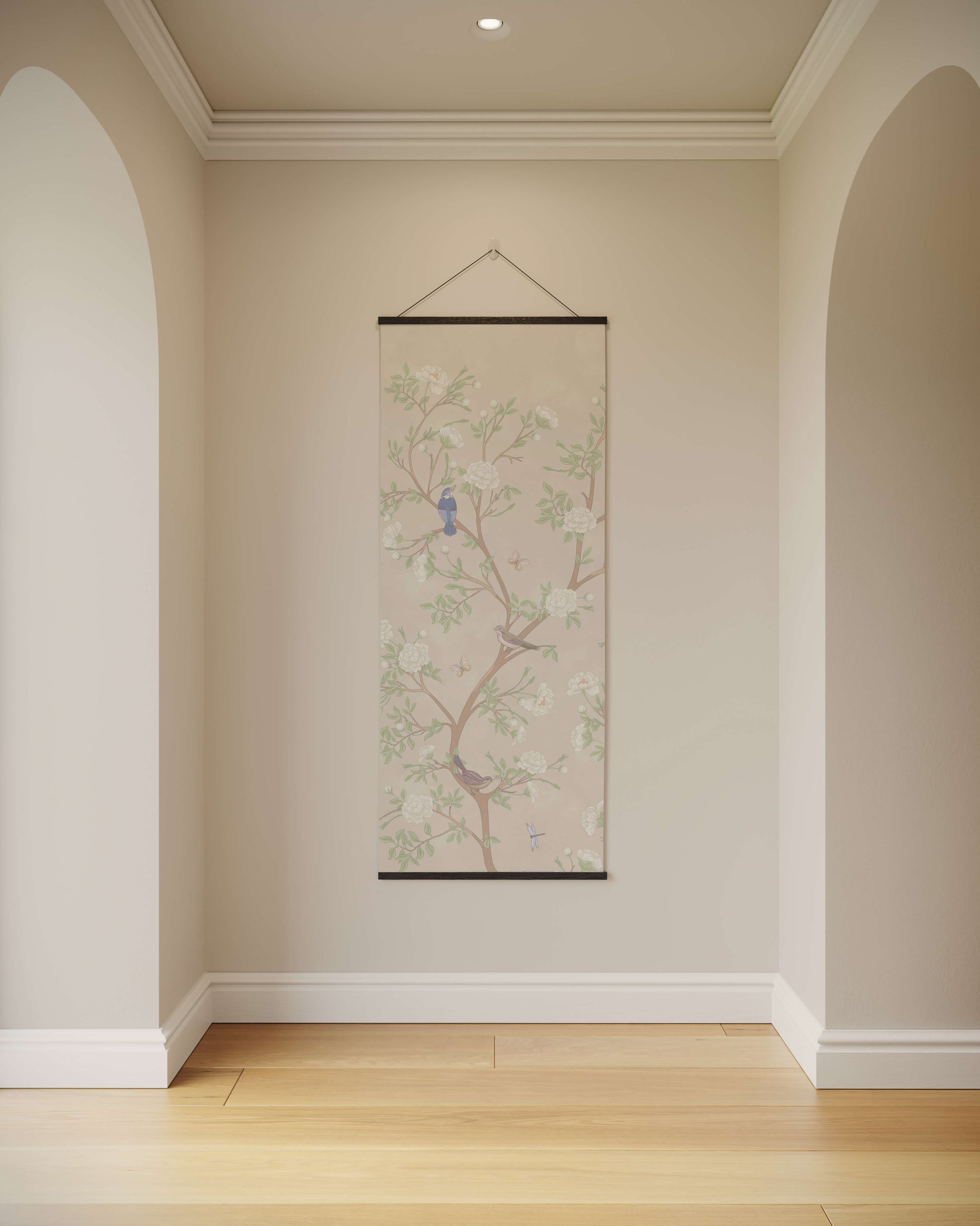Decorative wall scroll with floral design and birds hanging on a beige wall.