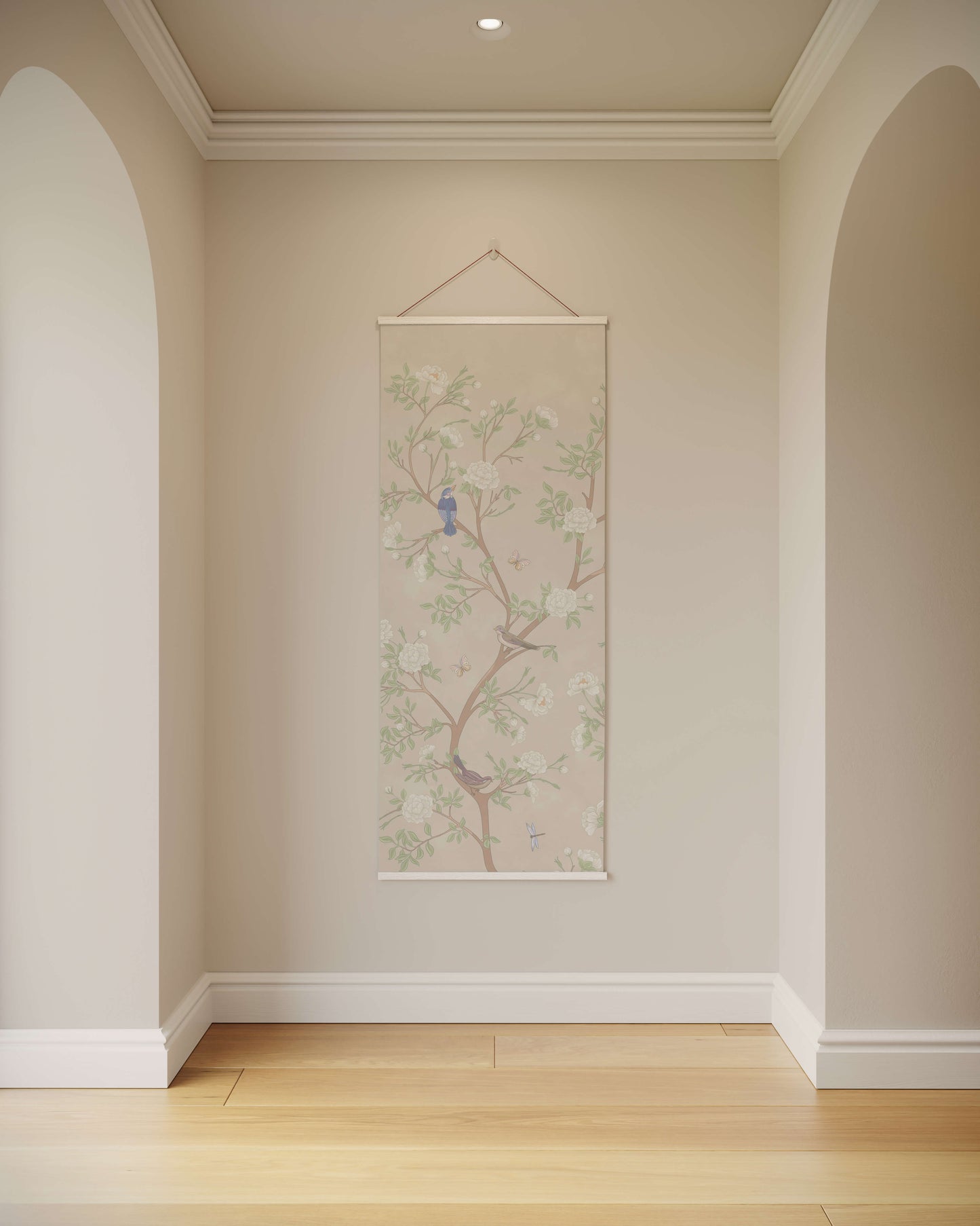 Decorative wall hanging with floral design and bird on a light-coloured wall.