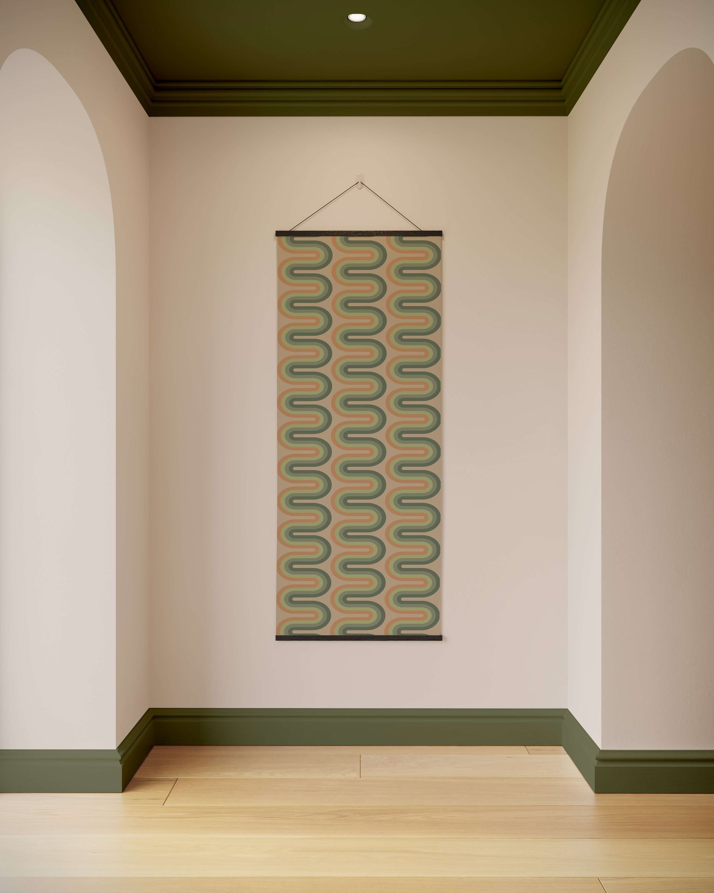 Woven wall hanging with geometric pattern on a plain wall.