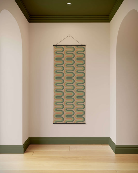 Woven wall hanging with geometric pattern on a plain wall.