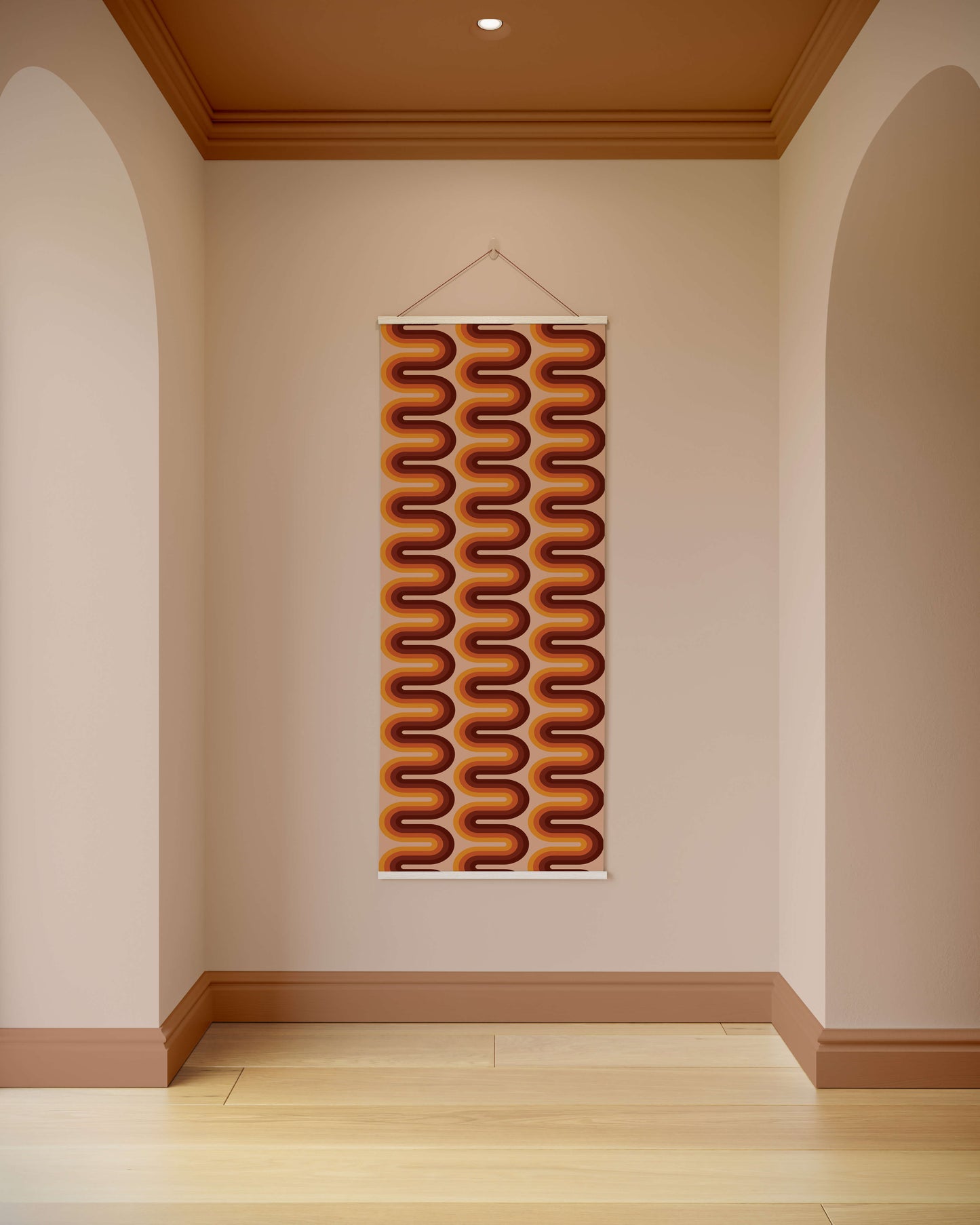 Decorative wall hanging with wavy pattern on a plain wall.