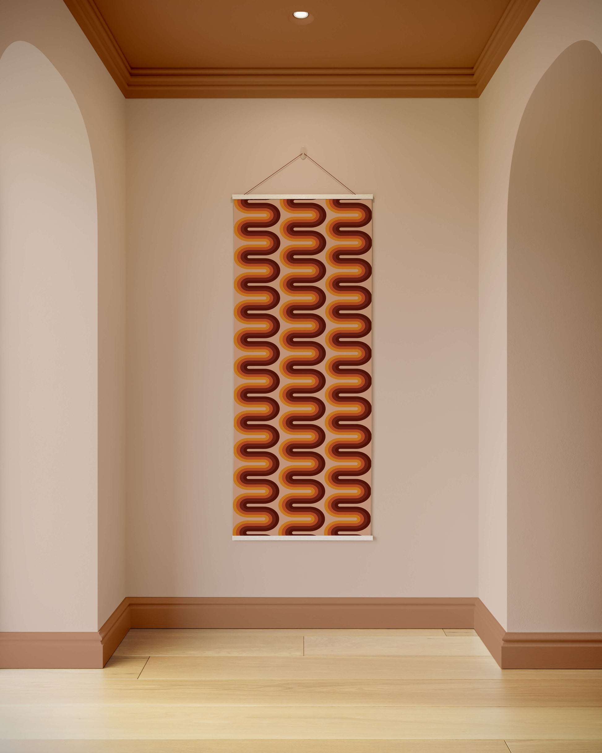 Decorative wall hanging with wavy pattern on a plain wall.