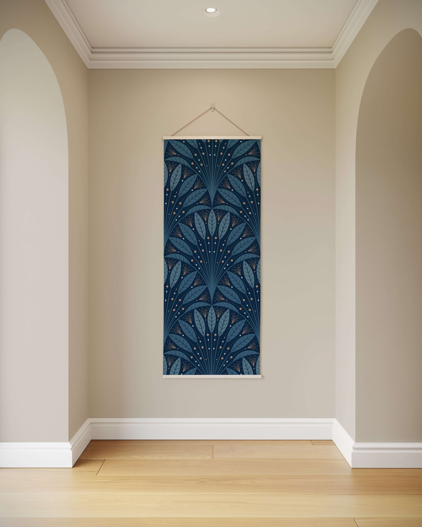 Decorative wall hanging with blue leaf pattern on a beige wall.