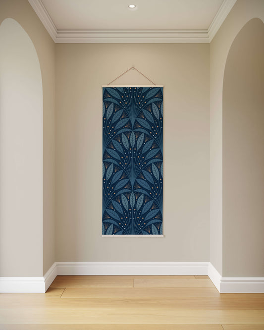 Decorative wall hanging with blue leaf pattern on a beige wall.