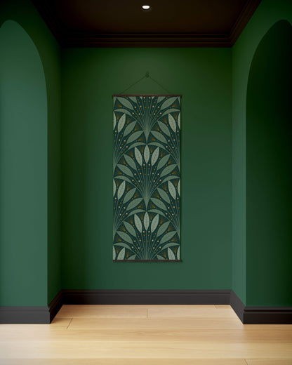 Decorative tapestry with a leaf pattern hanging on a green wall.