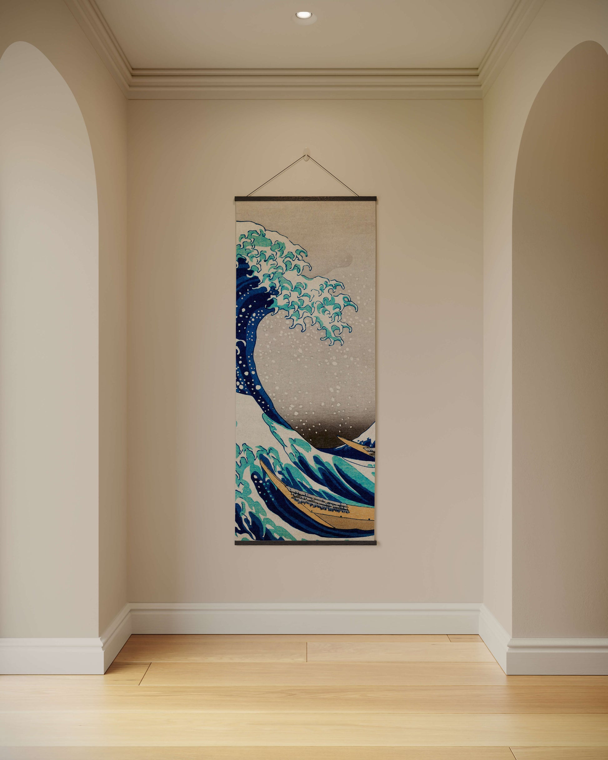 Decorative tapestry of a wave hanging on a wall in a room with wooden flooring.