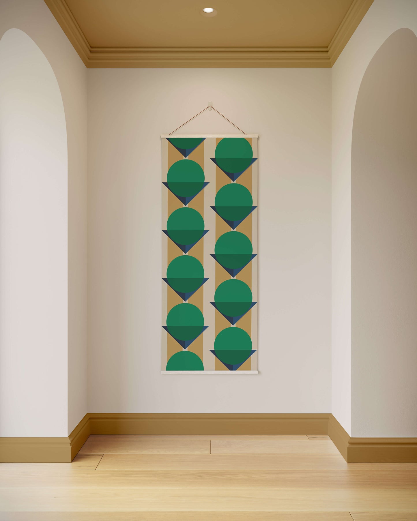 Geometric patterned tapestry hanging on a wall in a room with wooden flooring and archways.