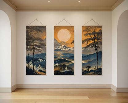 Three landscape paintings hanging on a wall in a room with wooden flooring.