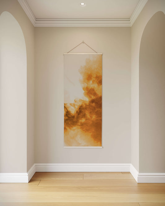 Wall art hanging on a beige wall in a room with wooden flooring.