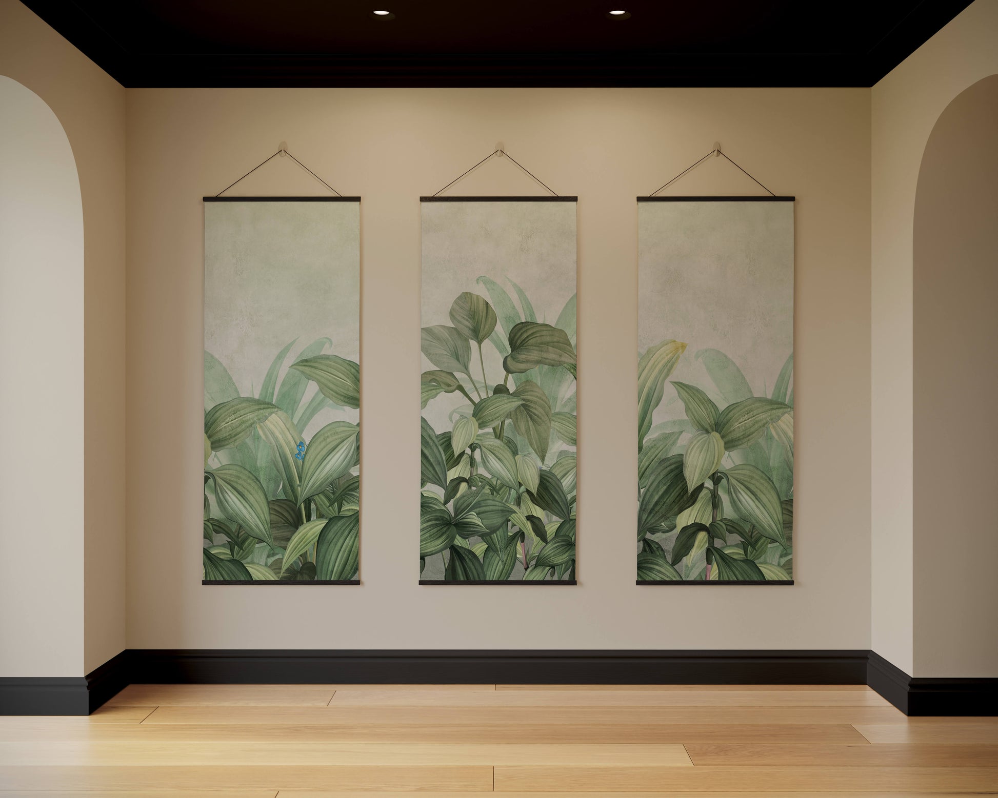 Three vertical wall hangings with green leaf patterns on a beige wall.