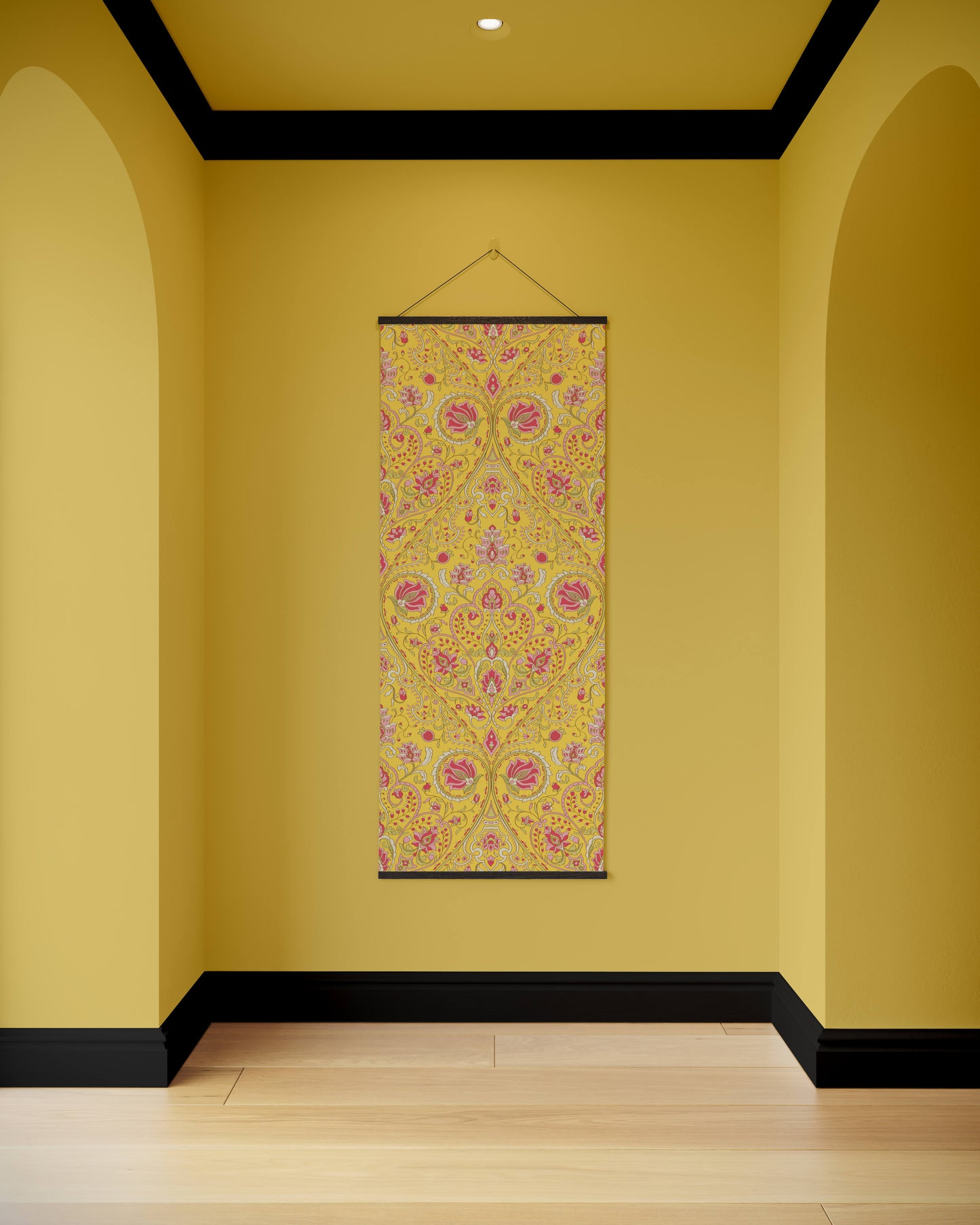 Decorative floral tapestry hanging on a yellow wall with arches.