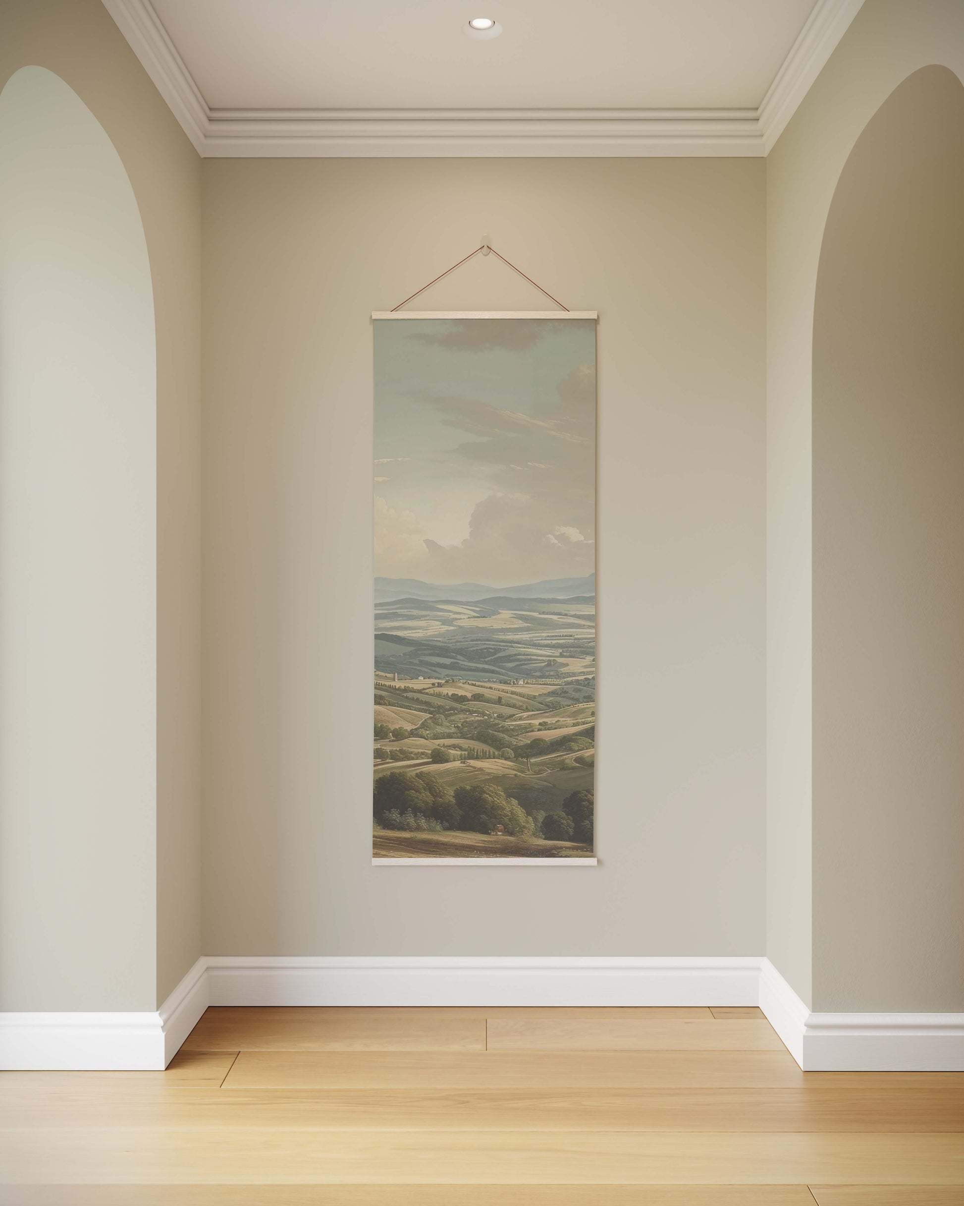Wall painting of a landscape hanging on a beige wall with wooden floor.