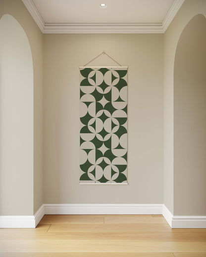 Green and white patterned wall hanging on a beige wall