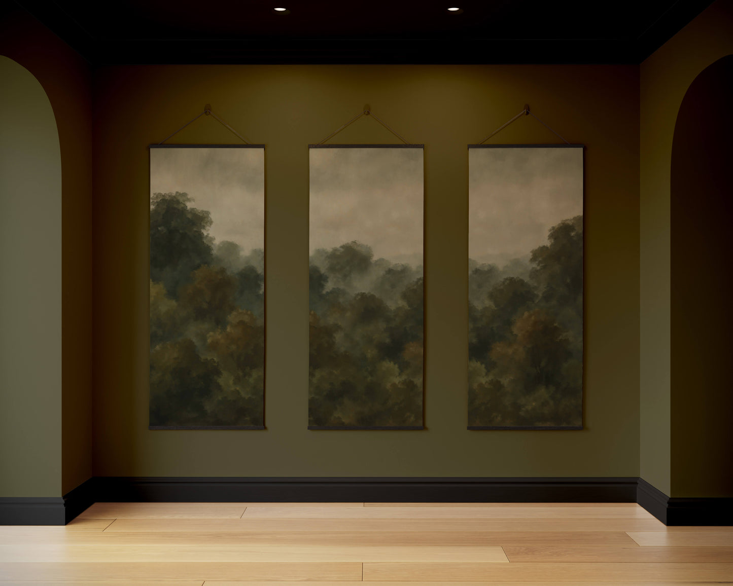 Three large landscape paintings hanging on a wall in a dark room.
