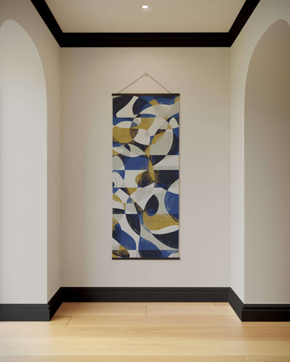 Abstract wall art hanging on a white wall with a wooden floor and black baseboard.