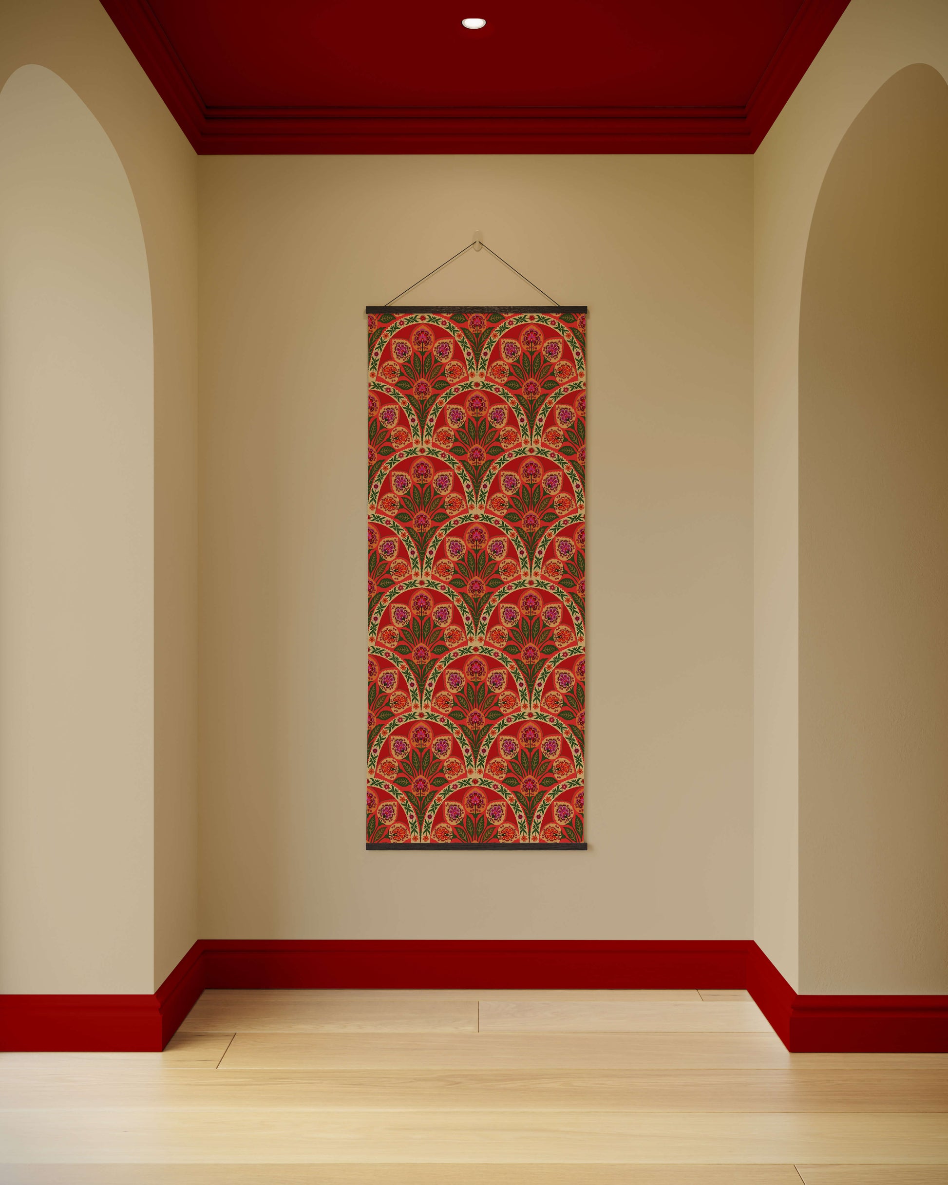 Decorative wall hanging with a red and gold pattern on a beige wall with red trim.