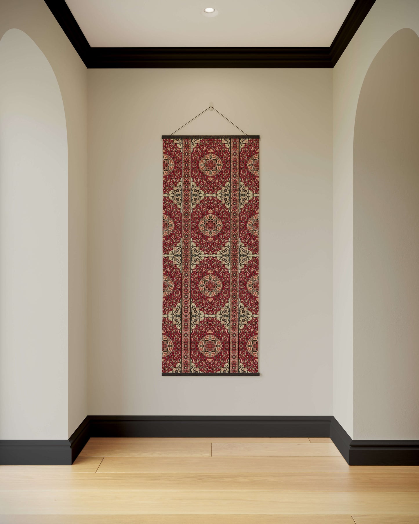 Decorative wall hanging with a red and gold pattern on a plain wall.