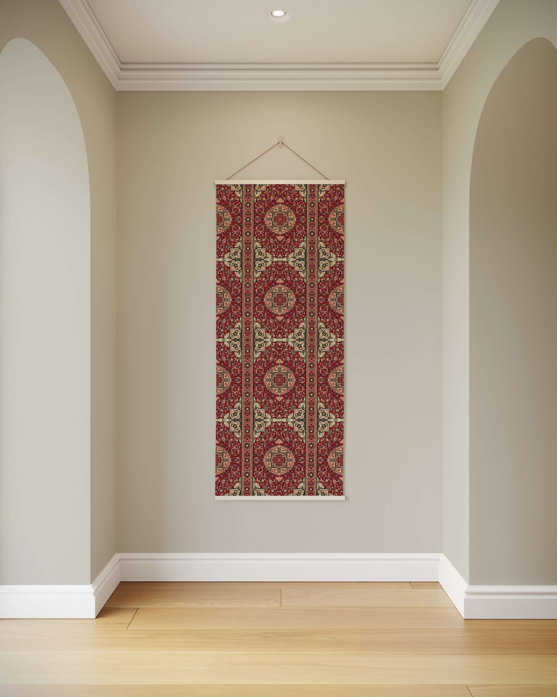 Decorative tapestry with a red and gold pattern hanging on a wall.