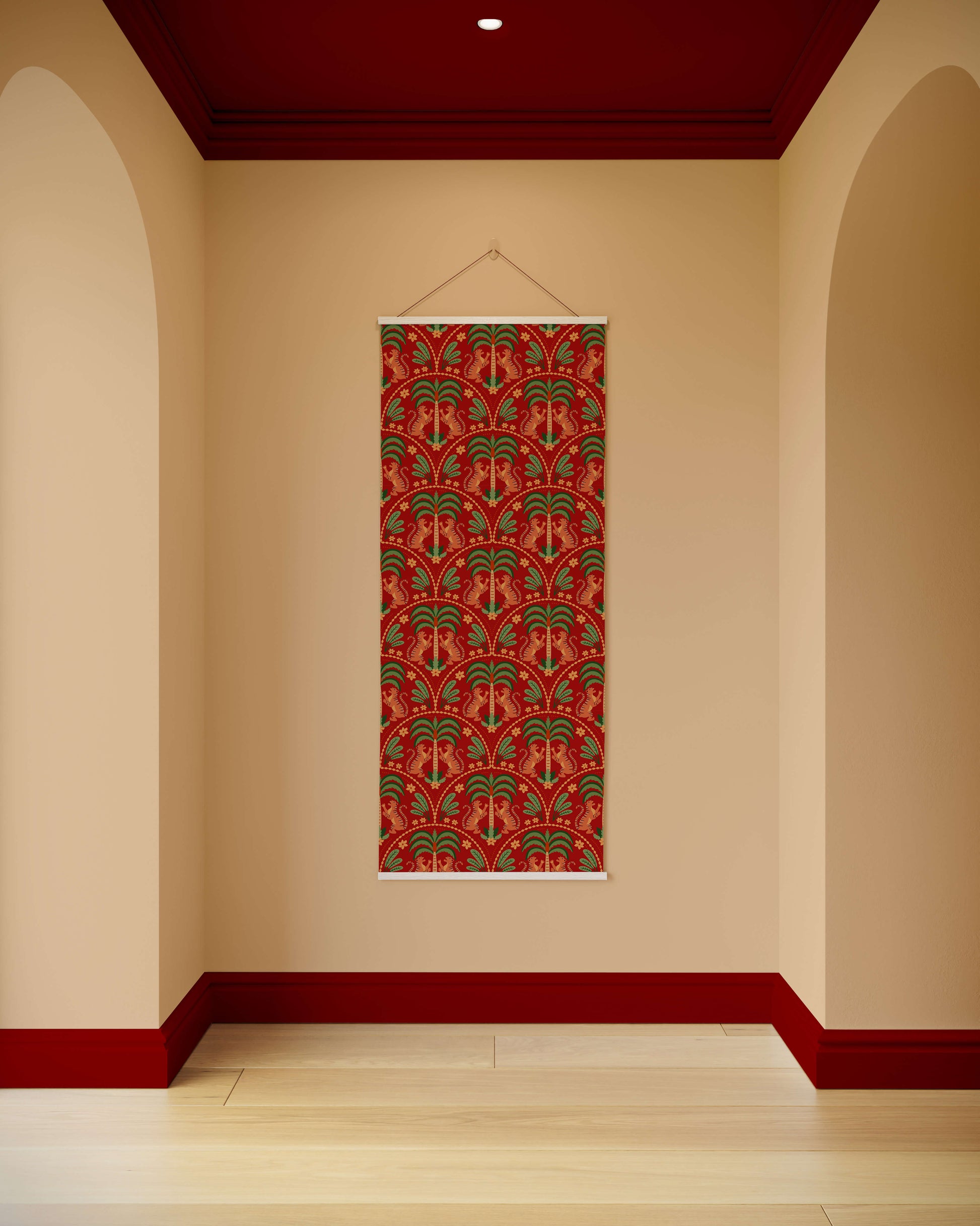 Decorative wall hanging with a red and gold pattern on a beige wall with red trim.