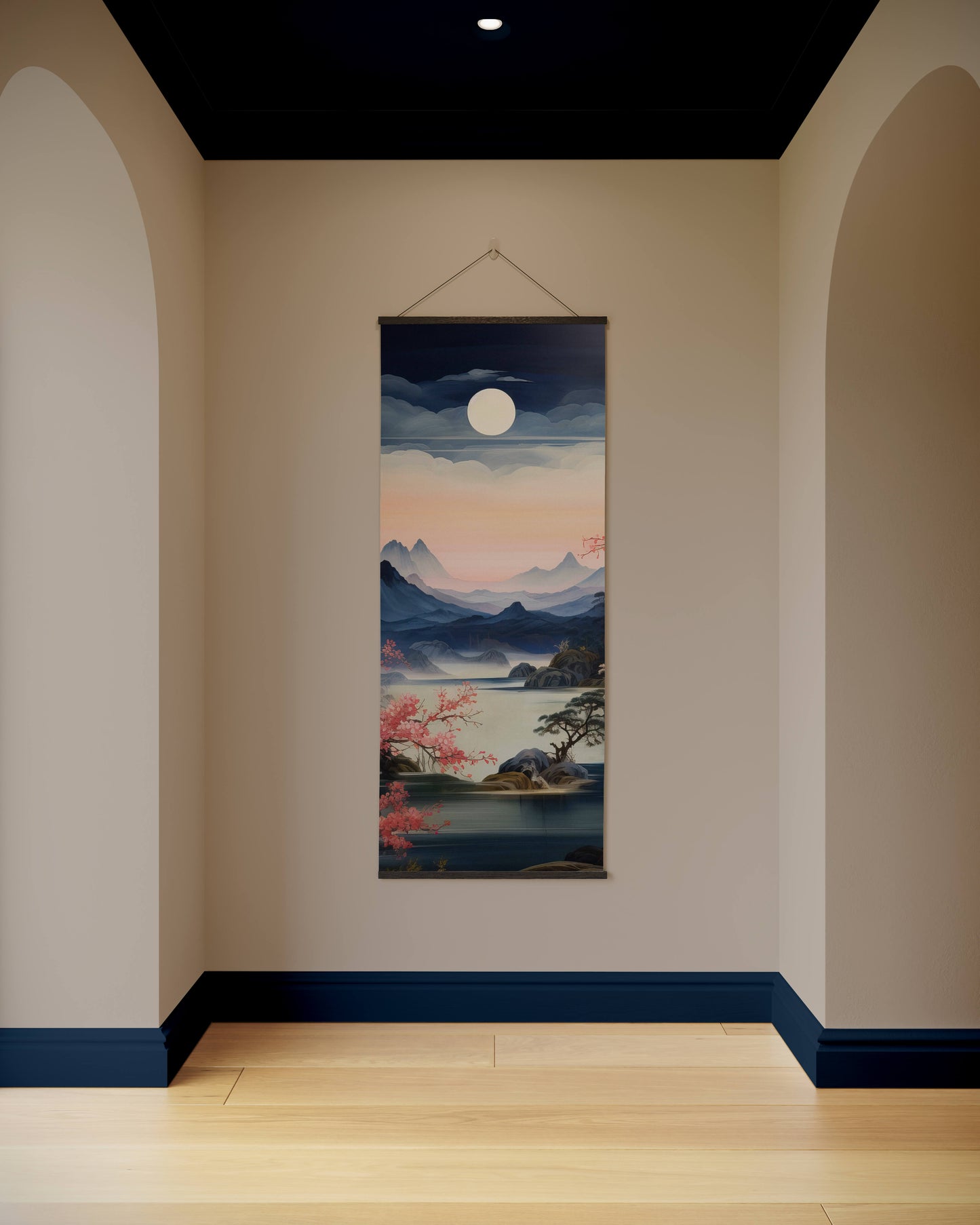 Wall tapestry with a scenic design hanging on a wall in a room with arches and a dark ceiling.
