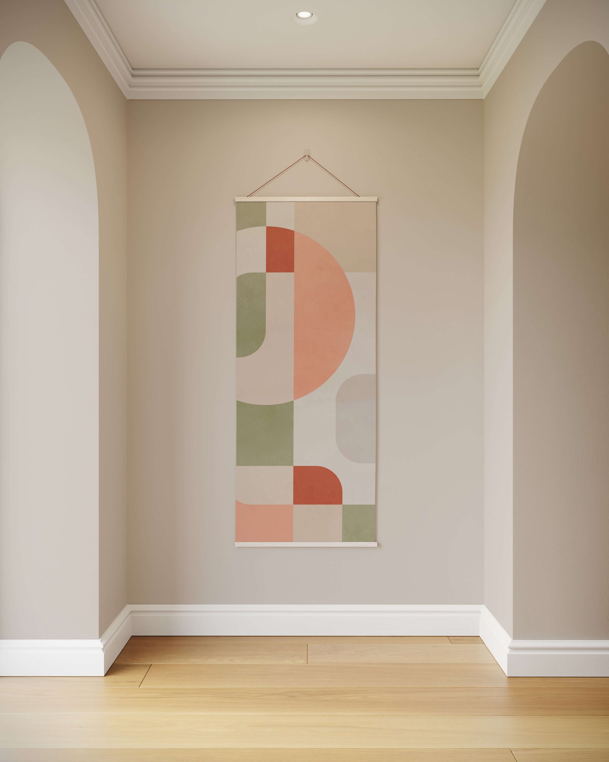 Abstract wall hanging with geometric design on a neutral wall.