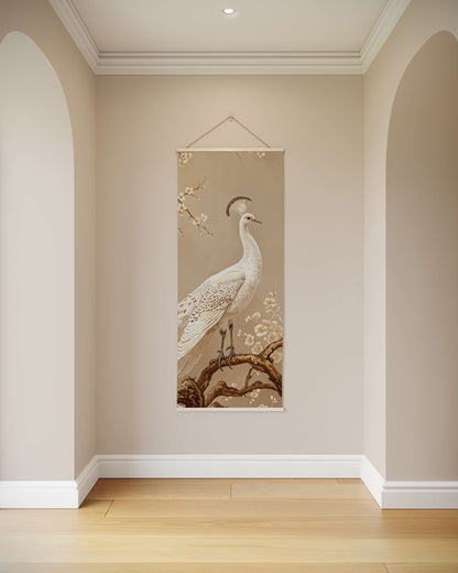 Decorative wall hanging of a peacock on a beige wall.