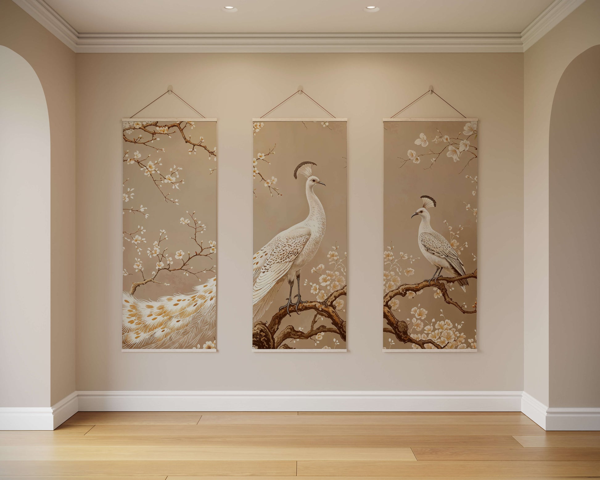 Three vertical wall hangings with bird and floral designs on a beige wall.