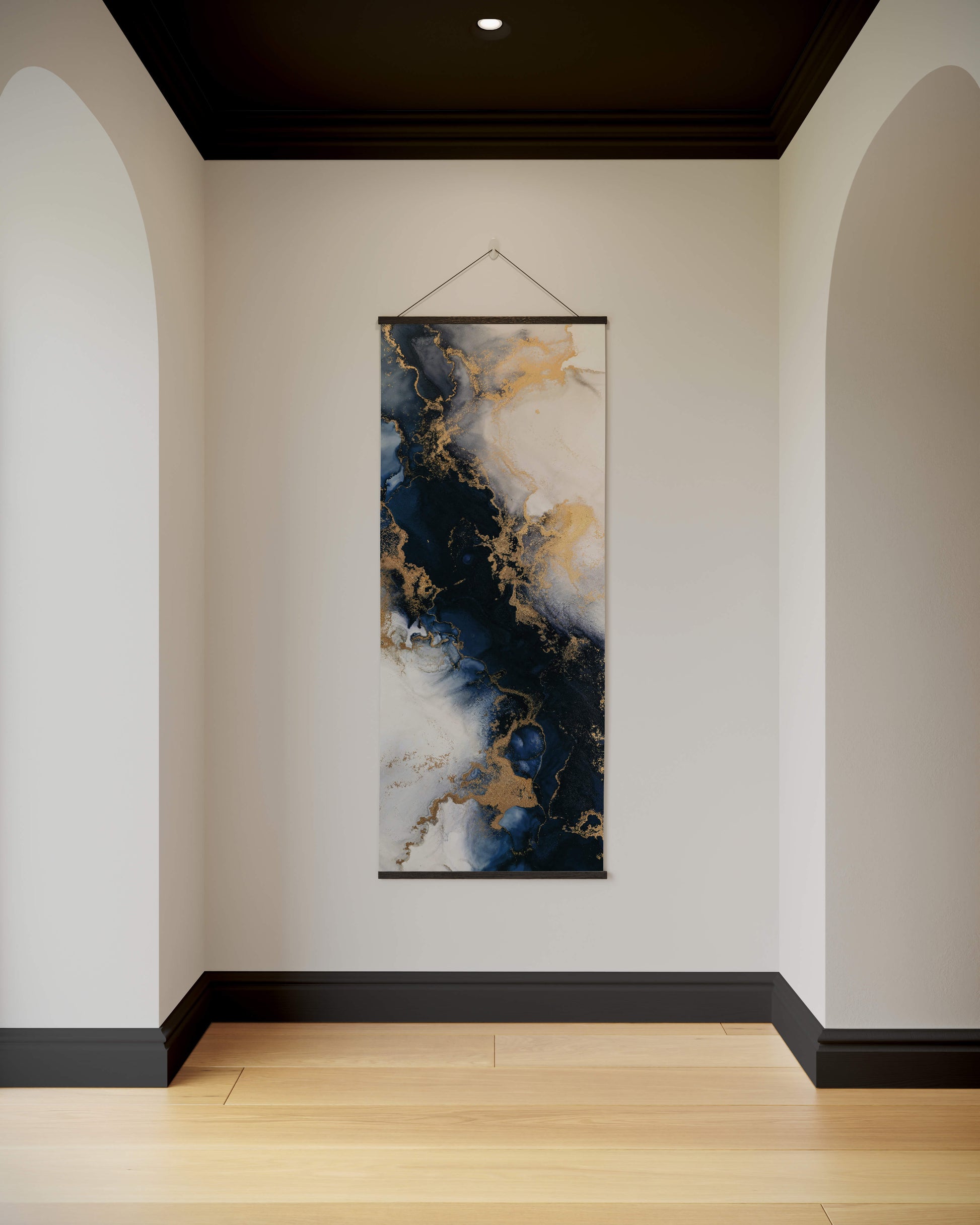 Abstract wall art hanging on a white wall with arched doorways.