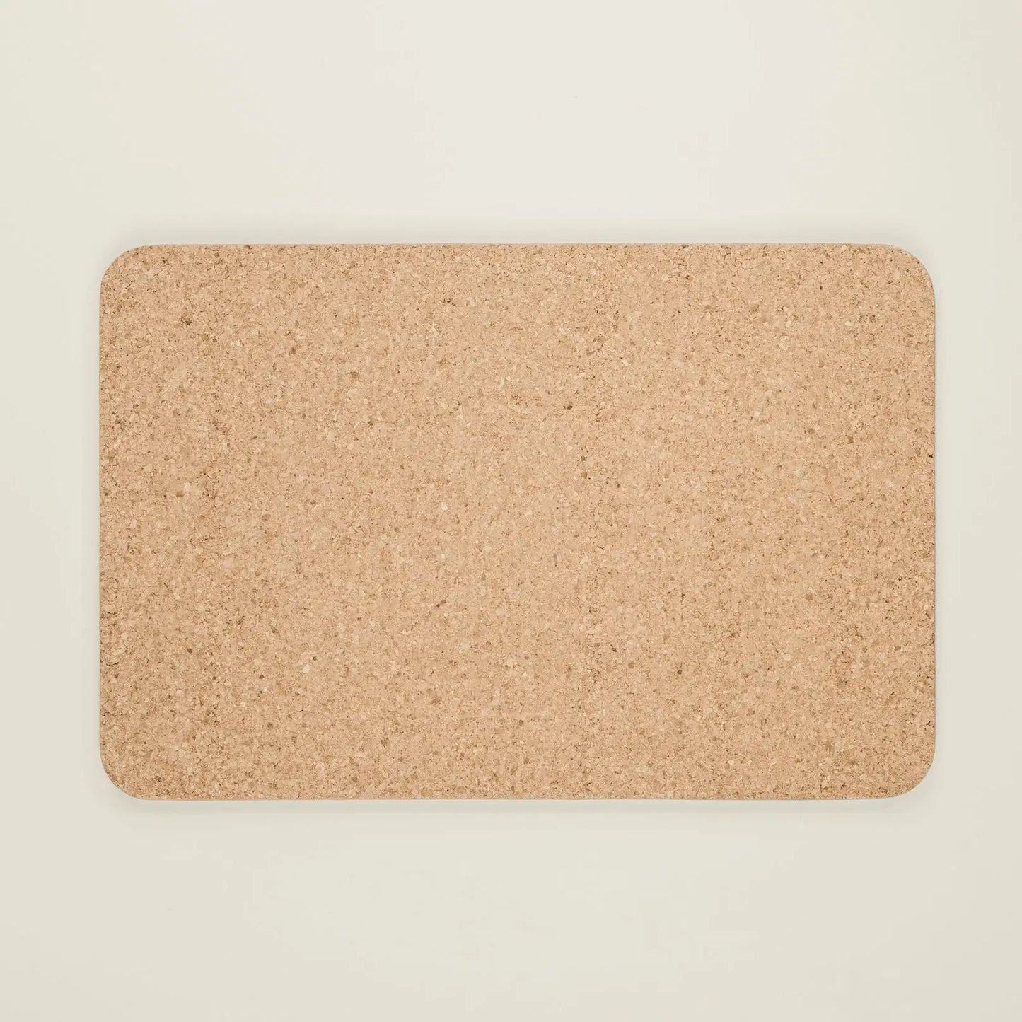 Rectangular cork mat on a beige background