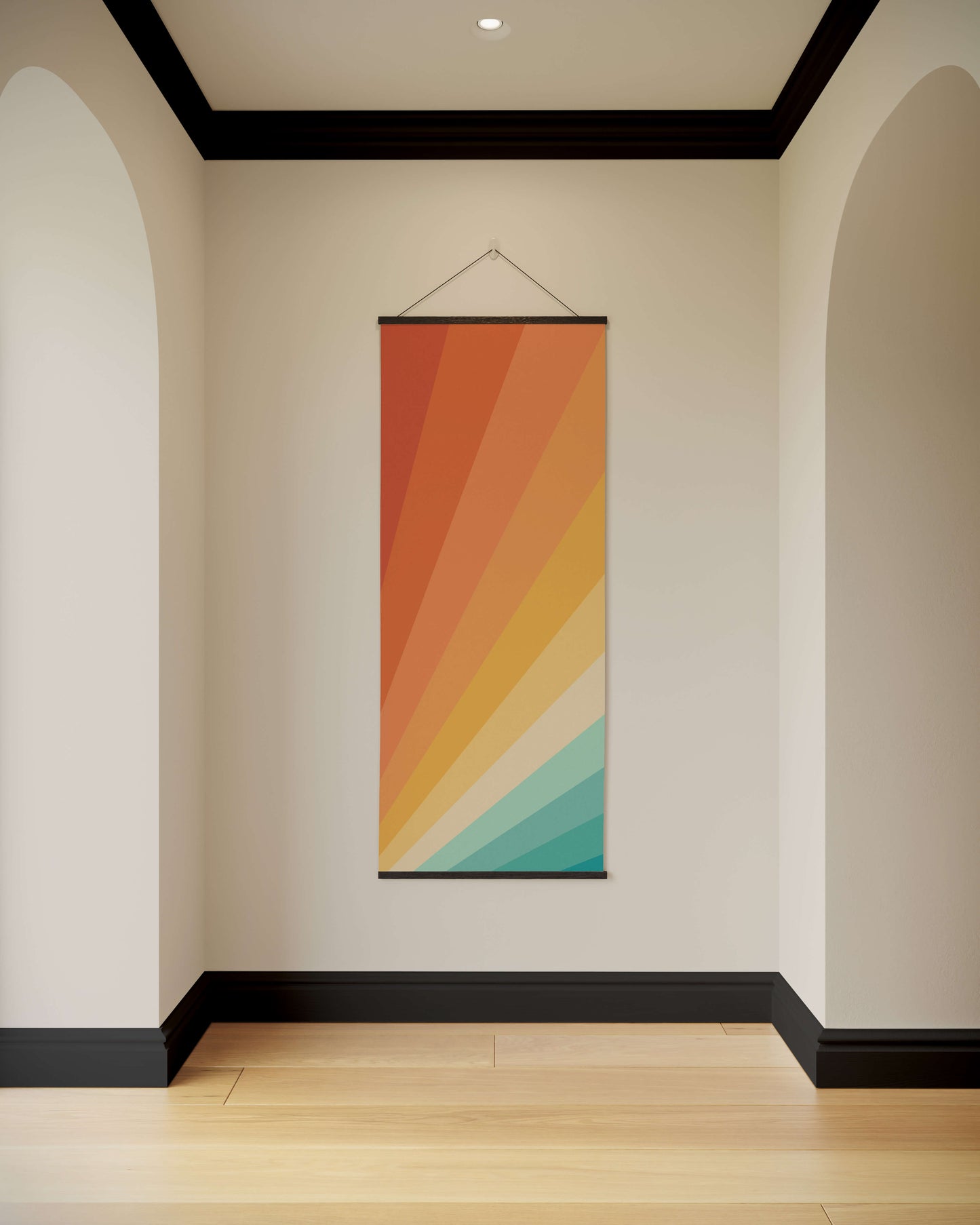 Colourful abstract wall hanging on a plain wall with arches and a wooden floor.