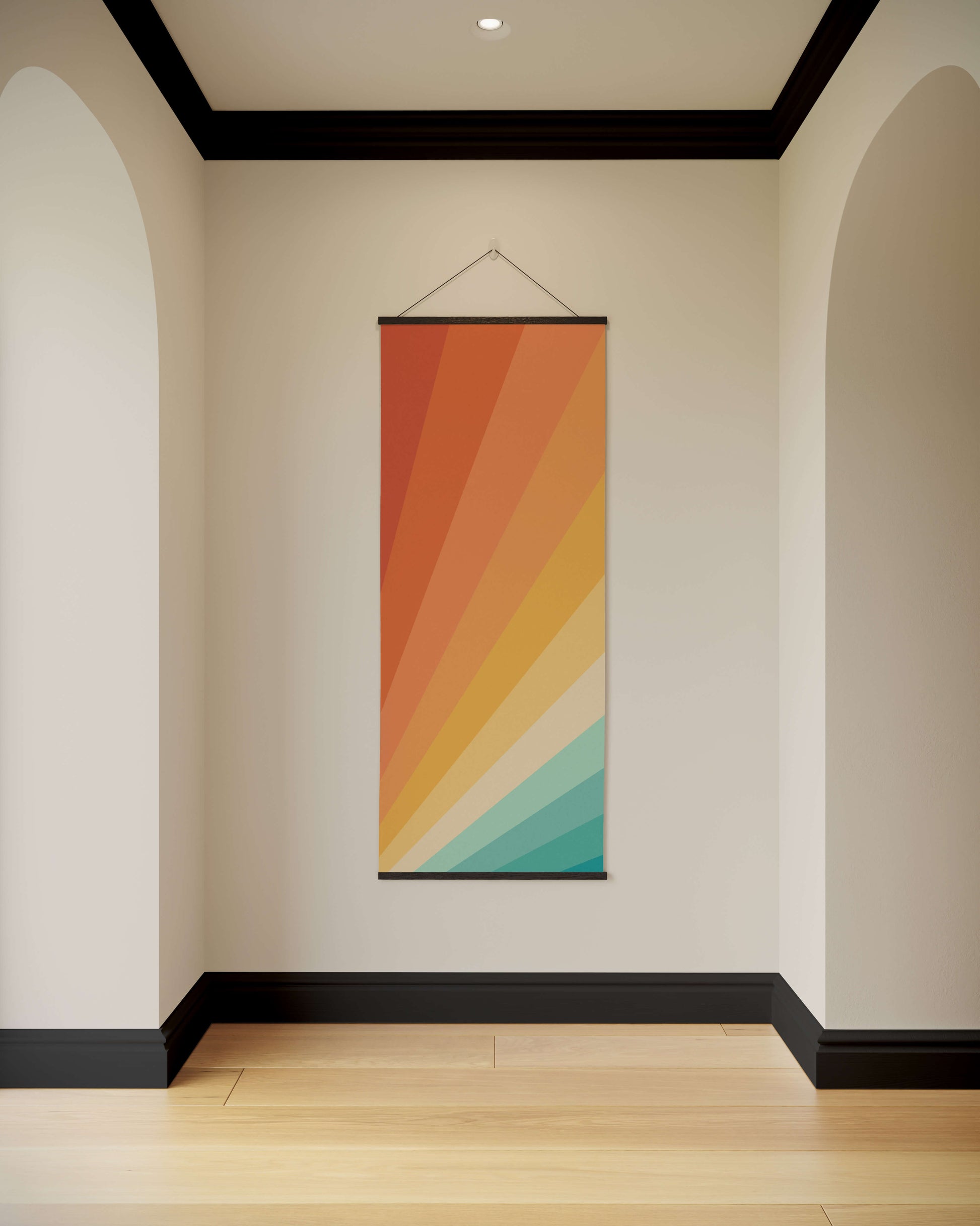 Colourful abstract wall hanging on a plain wall with arches and a wooden floor.