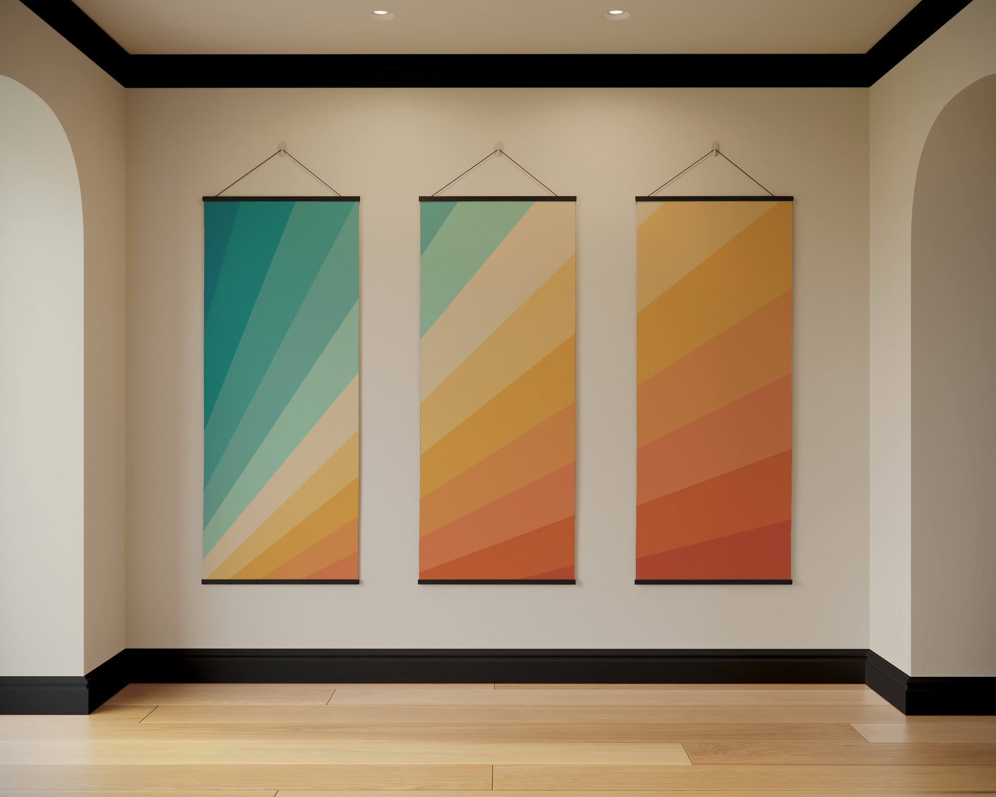Three colourful abstract wall hangings on a beige wall.