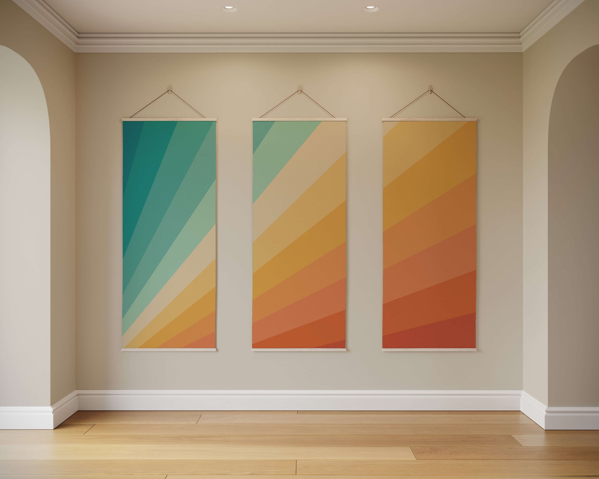 Three colourful abstract wall hangings on a beige wall.