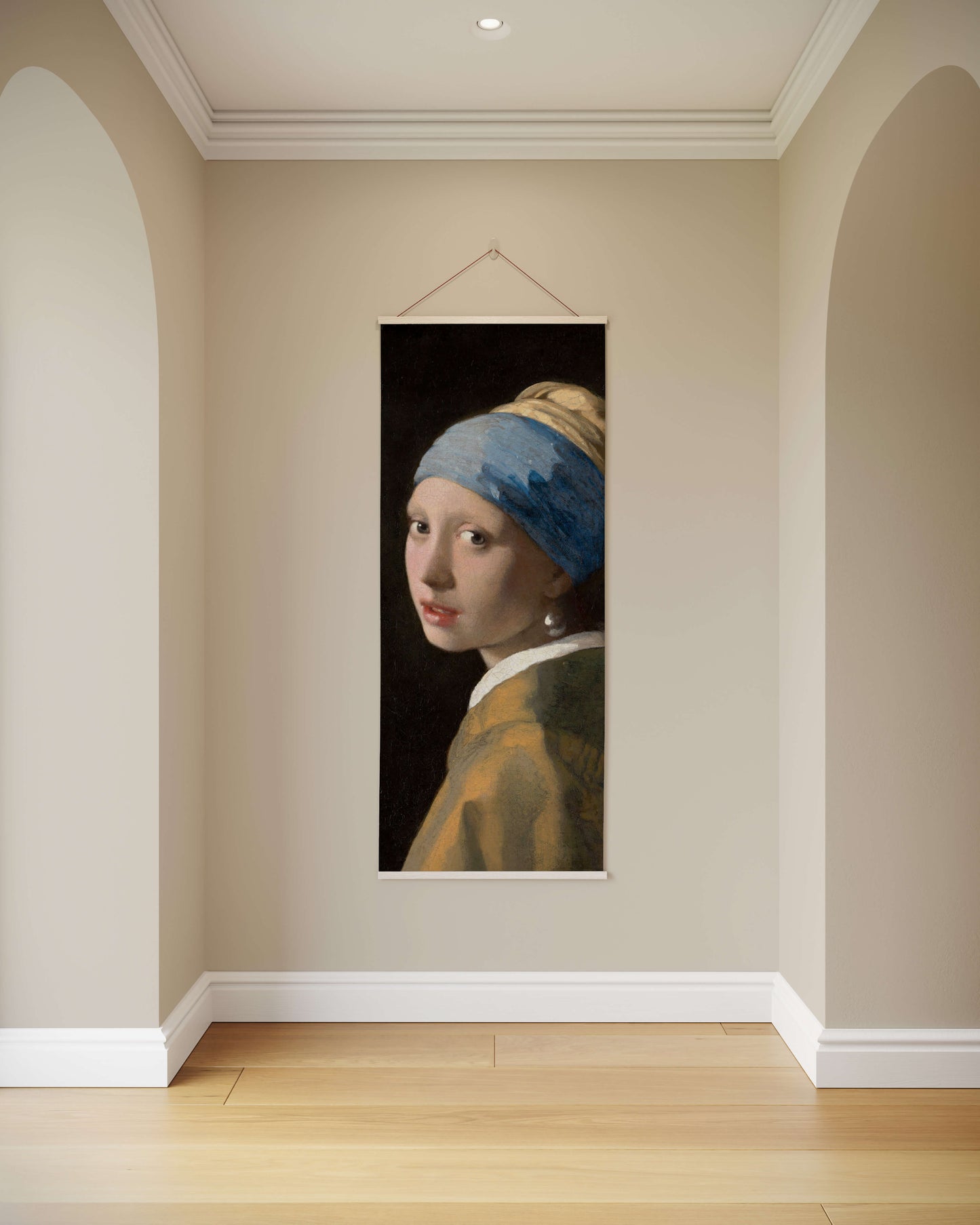 Poster of 'Girl with a Pearl Earring' by Vermeer hanging on a wall.