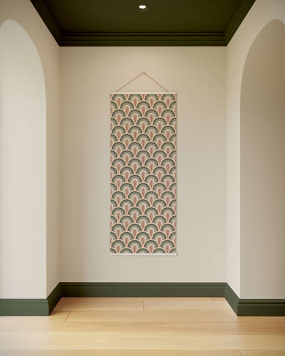 Decorative wall hanging with a geometric pattern on a plain wall.