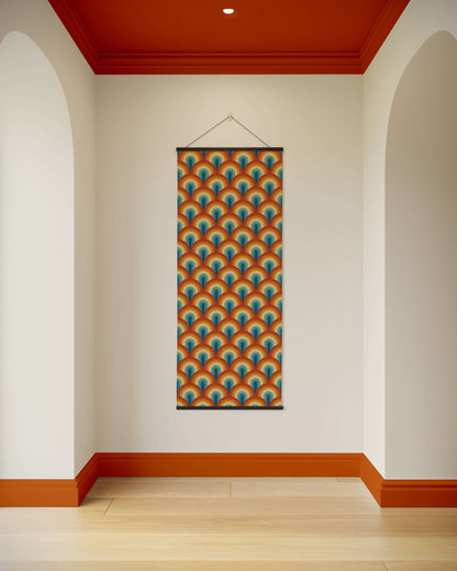 Colourful geometric patterned poster on a white wall with red trim.