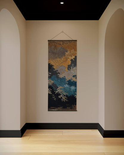Abstract wall tapestry hanging in a room with arches and a neutral color palette.